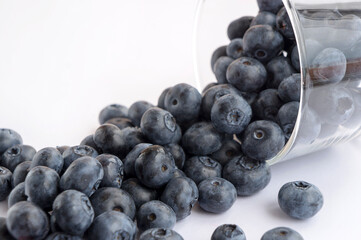 Lots of blueberry (heathberry) in a glass. Closeup view