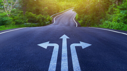 Arrows on asphalt road ground with three direction arrow choices, left, right or move forward on Curve of the road, difficult decision making concept, Motivation and growth.