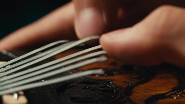 Jazz man playing on kalimba, african Hands Play music on Kalimba, Sound Recording in studio, traditional instruments.