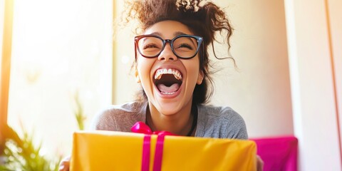 Young woman receives a large gift and reacts with joyful surprise at home mockup