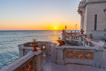 Scenic sunset view from Miramare Castle terrace overlooking Adriatic Sea horizon
