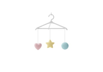 Isolated baby mobile with heart star and sphere suspended on a hanger on threads indoors