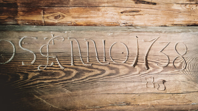 Engraving on a wooden wall, in a stave church - "Anno 1738"