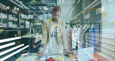 Fashion designer reading samples and summoning holographic data panels for fashion analytics charts - Powered by Adobe