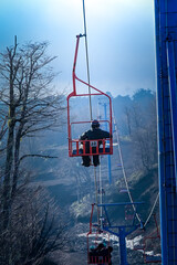 skier going up the cable car in Pucon, Chile