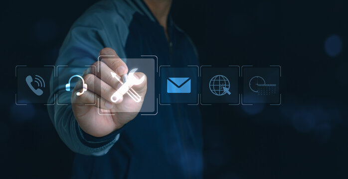 Customer support and technical service concept with man touching virtual icons of tools, email, call center and online communication for business assistance, remote IT solutions, and digital helpdesk.
