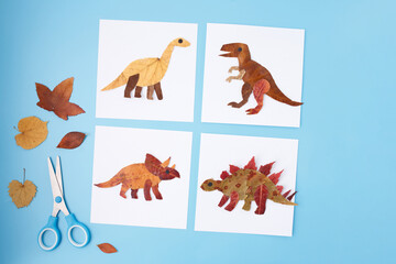 Paper collage dinosaurs created from autumn dried leaves flat lay handmade diy project school education activity children craft design for card creative seasonal campaign learning supplies,