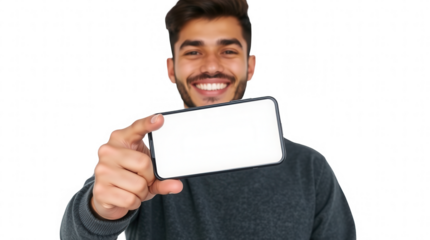 A young man beams with joy as he holds up a smartphone showcasing a blank screen. His bright smile and casual attire create an inviting atmosphere