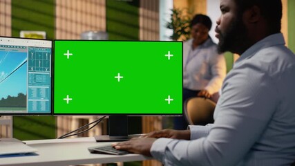 Technician works on power line tower CAD design on green screen PC in office. RD department worker uses program on chroma key computer to optimize transmission tower systems, camera B - Powered by Adobe