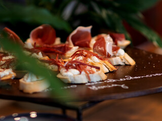 Delicious Crostini Topped with Cured Meat and Cheese