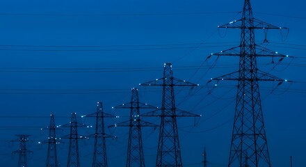 Power Line Array: An array of towering power lines stretches towards the horizon against a twilight sky, representing energy transmission and infrastructure.