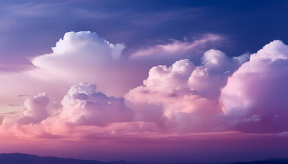 Obraz premium a soft dreamy sky with a gradient of pink and purple hues featuring wispy white clouds