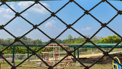 playground from behind an iron fence