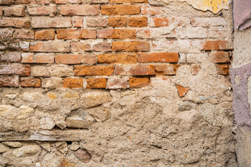 Peeling mortar on an old brick wall.
