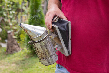 Smoker for use with honey bee hives.