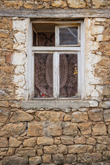 Window in an old rough stone building.