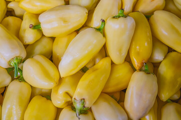 Fresh ripe yellow chili peppers for sale at a market in Nish.
