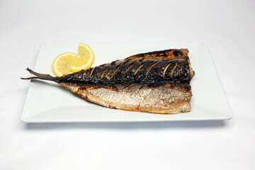 High resolution photo of Korean grilled mackerel served on white background. A savory and nutritious traditional Korean fish dish, popular as a healthy everyday meal.