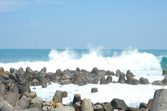Breakwater, wave, sea , beach and blue sky. Beautiful scenery for holiday, nature background for wallpaper. Pemecah ombak, pantao, laut.