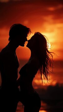 Romantic silhouette couple kissing at sunset on beach with warm glowing sky and intimate embrace symbolizing love passion and connection