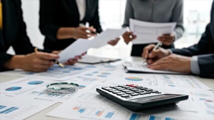 Close Up Calculator and Magnifying Glass on Financial Documents | Business Team Analyzing Data, Reviewing Reports, Collaborating in Office Workspace | Audit, Tax, Finance, Accounting Concept