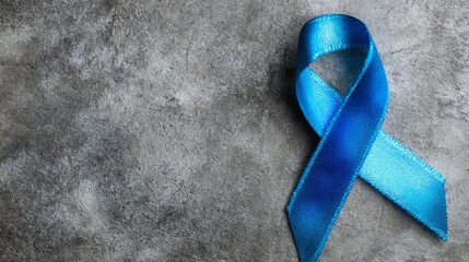 Blue Awareness Ribbon on Textured Gray Background – Symbolic Support Icon for Human Trafficking Awareness Campaigns and World Day Against Trafficking in Persons