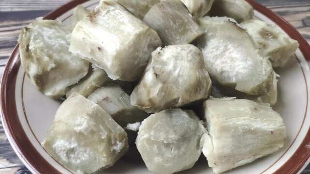 A delicious pile of boiled sweet potato slices on a plate. Ipomoea batatas L. is a tuber that is widely found in Indonesia and is beneficial for digestion.