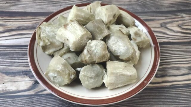 A delicious pile of boiled sweet potato slices on a plate. Ipomoea batatas L. is a tuber that is widely found in Indonesia and is beneficial for digestion.
