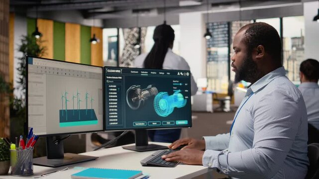 Renewable energy engineer in office upgrades windmill farm infrastructure with eco friendly turbines. RD department worker researching sustainable materials for wind power generation gear, camera A