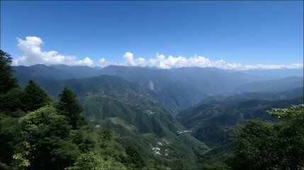 Obraz premium Majestic Green Mountain Valley Landscape Under Blue Sky