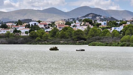 Enjoy a stunning lake view surrounded by majestic mountains and charming houses
