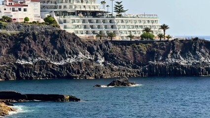 Experience the stunning and breathtaking view of a coastal resort with its rocky shoreline