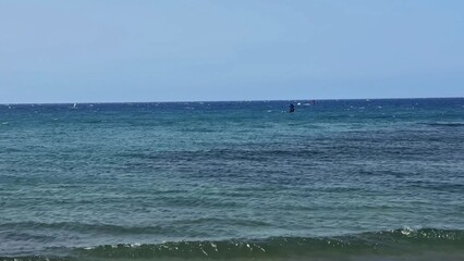 Experience a Serene Ocean View with Gentle Waves, Crystal Waters, and Clear Beautiful Skies