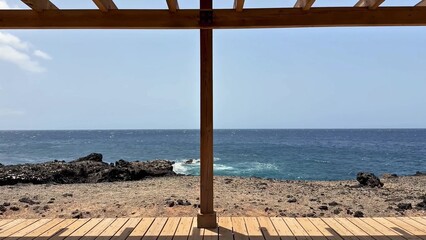 A breathtaking and stunning scenic ocean view from a beautifully crafted wooden pergola awaits you