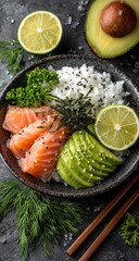 Bowl of rice, salmon, avocado, and lime