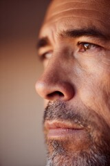 Fototapeta premium Portrait captures deep contemplation, highlighting rugged featur