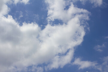 
Blue sky and puffy clouds.