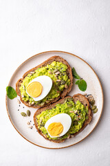Avocado toast with boiled egg, sunflower seeds, pumpkin seeds and sesame seeds, Healthy eating