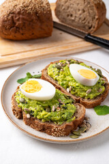Avocado toast with boiled egg, sunflower seeds, pumpkin seeds and sesame seeds, Healthy eating