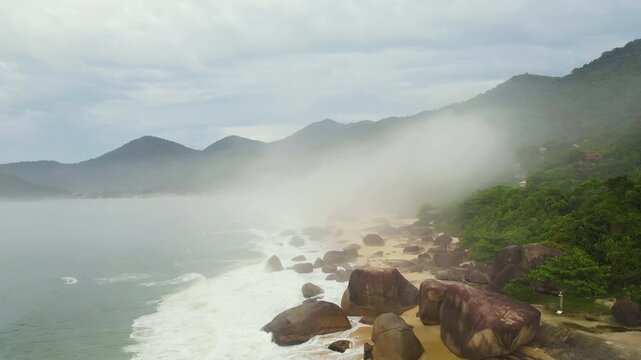 Aerial view over the Trinidade beach, cloudy day with fog in Brazil, South America