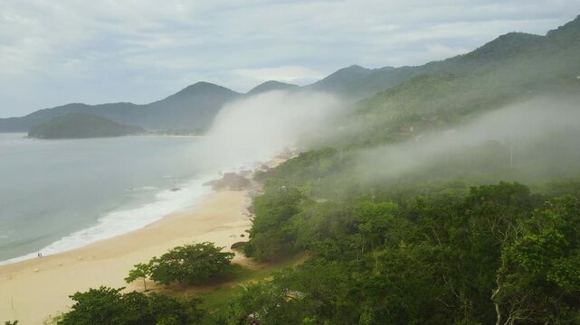 Drone flying along the Trinidade beach, foggy day in Brazil, South America