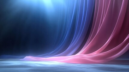 Soft, flowing fabric drapes in gradient colors under dramatic lighting.
