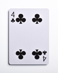 Four of clubs playing card, isolated on white background