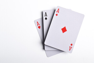 Flying playing card, three aces isolated on white background