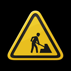 This yellow triangular warning sign, featuring a black silhouette of a person shoveling, effectively conveys ongoing construction or maintenance, isolated on a dark background.