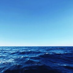 Fototapeta premium Deep Blue Ocean Waves Under Clear Sky