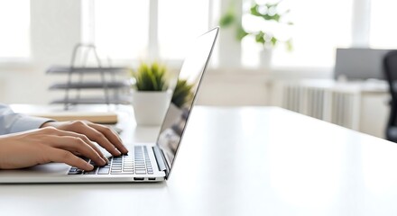 Close-up of hands typing on a laptop in a bright, professional setting. Shallow depth of field creates significant copy space. Ideal for corporate or communication themes.