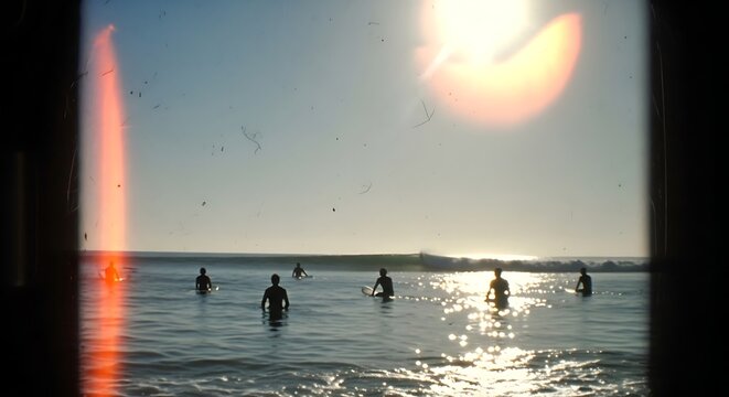 Vintage Super 8 film of friends swimming in the sea on a sunny summer day.
