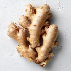 Fresh ginger root cluster on light background