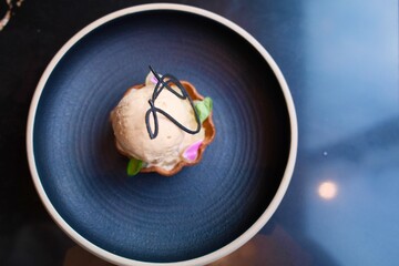 Stylish dessert served in blue bowl
